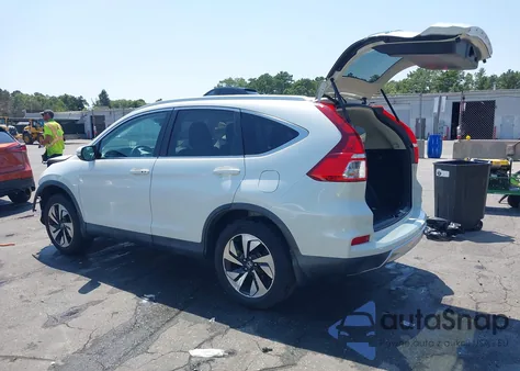 2015 Honda Cr-V Touring z USA, uszkodzony, nr VIN 5J6RM4H92FL116338